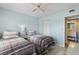 Cozy bedroom with two beds, ceiling fan, and access to an ensuite bathroom for added convenience at 6021 Bahia Del Mar Cir # 239, St Petersburg, FL 33715