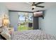 Cozy bedroom with a sliding glass door leading to a patio and picturesque waterfront views at 6021 Bahia Del Mar Cir # 239, St Petersburg, FL 33715