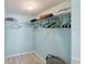 Organized walk-in closet with ample shelving and hanging space for clothes and storage at 6021 Bahia Del Mar Cir # 239, St Petersburg, FL 33715