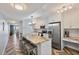 Modern kitchen with white cabinetry, stainless steel appliances, and an island with barstool seating at 6021 Bahia Del Mar Cir # 239, St Petersburg, FL 33715