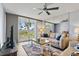 Inviting living room featuring cozy furniture, stylish rug, and a lovely view through sliding glass doors at 6021 Bahia Del Mar Cir # 239, St Petersburg, FL 33715