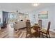 Comfortable living room with dining table and sliding glass doors leading to a scenic view at 6021 Bahia Del Mar Cir # 239, St Petersburg, FL 33715