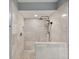 Modern walk-in shower with multiple shower heads, a tiled seat, and a sleek design at 6021 Bahia Del Mar Cir # 239, St Petersburg, FL 33715