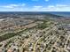 Wide aerial view of a residential area with lakes, well-maintained lawns, and nearby natural reserves at 6208 Florida E Cir, Apollo Beach, FL 33572