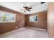 Empty bedroom featuring a ceiling fan, and two large windows providing ample natural light for a bright and airy atmosphere at 6208 Florida E Cir, Apollo Beach, FL 33572