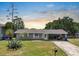 Charming single story home boasts a well-maintained lawn, mature landscaping and a covered carport at 6208 Florida E Cir, Apollo Beach, FL 33572