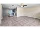 Bright living room featuring tiled floors, a ceiling fan, and neutral-toned walls at 6208 Florida E Cir, Apollo Beach, FL 33572
