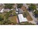 Aerial view shows a residence with a well-kept backyard, a shed, and neighborhood streets at 6235 17Th N Ave, St Petersburg, FL 33710