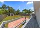 Spacious fenced backyard features a storage shed and wooden deck area with red brick patio at 6235 17Th N Ave, St Petersburg, FL 33710