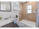 Clean bathroom with tiled shower and tub combination, complemented by an elegant vanity and mirror at 6235 17Th N Ave, St Petersburg, FL 33710