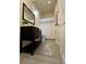 Bathroom features a vanity with marble countertop, wood-look tile floor, and neutral paint at 6235 17Th N Ave, St Petersburg, FL 33710