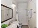 Bathroom features a vanity with marble countertop, updated walk-in shower and neutral paint at 6235 17Th N Ave, St Petersburg, FL 33710