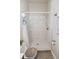 Modern walk-in shower with marble-style tile and a modern shower head, creating a clean and bright space at 6235 17Th N Ave, St Petersburg, FL 33710