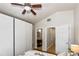 Bedroom with ceiling fan, hardwood flooring, large wardrobe and ensuite access at 6235 17Th N Ave, St Petersburg, FL 33710