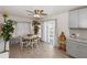 Bright dining area with a ceiling fan and a glass sliding door that opens to the outside at 6235 17Th N Ave, St Petersburg, FL 33710
