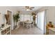 Bright dining area featuring tile flooring, a ceiling fan, and natural light from the windows at 6235 17Th N Ave, St Petersburg, FL 33710