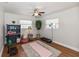 Bright exercise room features hardwood floors, neutral walls, ceiling fan and natural light at 6235 17Th N Ave, St Petersburg, FL 33710