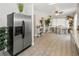 Open concept kitchen with stainless steel appliances and adjacent dining area at 6235 17Th N Ave, St Petersburg, FL 33710