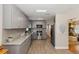 Modern kitchen with stainless steel appliances, granite countertops, and gray cabinets and tiled flooring at 6235 17Th N Ave, St Petersburg, FL 33710
