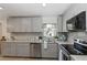 Stylish kitchen featuring granite countertops, stainless steel appliances, and ample cabinet space at 6235 17Th N Ave, St Petersburg, FL 33710
