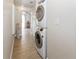 Hallway laundry closet area with stacked washer and dryer units at 6235 17Th N Ave, St Petersburg, FL 33710