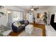 Inviting living room features hardwood floors, a ceiling fan, and a cozy sofa at 6235 17Th N Ave, St Petersburg, FL 33710