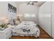 Comfortable main bedroom features a ceiling fan, artwork, and closet at 6235 17Th N Ave, St Petersburg, FL 33710