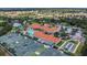 Aerial view of community clubhouse, pools, tennis courts, bocce ball and surrounding neighborhood at 6315 43Rd E Ct, Sarasota, FL 34243