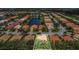 Aerial view showcases the home's location within a desirable community with lake views at 6315 43Rd E Ct, Sarasota, FL 34243