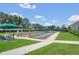 Outdoor bocce ball courts are lined with manicured landscaping, with players enjoying a sunny day at 6315 43Rd E Ct, Sarasota, FL 34243