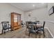 Formal dining room featuring dark wood table and chairs, along with a china cabinet at 6315 43Rd E Ct, Sarasota, FL 34243