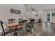 Elegant dining room with sleek hardwood floors and plenty of space for entertaining at 6315 43Rd E Ct, Sarasota, FL 34243