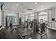 Bright fitness center with modern exercise equipment, large windows, and mirrors at 6315 43Rd E Ct, Sarasota, FL 34243