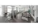 Bright fitness center with modern exercise equipment, large windows, and mirrors at 6315 43Rd E Ct, Sarasota, FL 34243