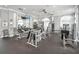 The gym with ceiling fans and an array of weight machines offers residents a convenient fitness space at 6315 43Rd E Ct, Sarasota, FL 34243