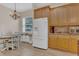 Bright kitchen with stainless steel fridge, ample counters, and a sunlit dining nook at 6315 43Rd E Ct, Sarasota, FL 34243