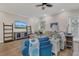 Bright living room with hardwood floors, neutral walls, stylish furniture, and large windows at 6315 43Rd E Ct, Sarasota, FL 34243