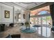 Welcoming lobby with high ceilings, chandelier, comfortable seating, and exterior views at 6315 43Rd E Ct, Sarasota, FL 34243