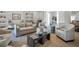 Well-lit community lounge with sofas, chairs, side tables, stylish décor, and ample space for entertaining guests at 6315 43Rd E Ct, Sarasota, FL 34243