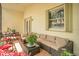 Inviting covered patio with wicker seating, perfect for relaxing outdoors at 6315 43Rd E Ct, Sarasota, FL 34243