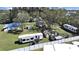 Aerial view of the property showing multiple sheds, homes, and RVs on a grassy lot at 6673 146Th N Ave, Clearwater, FL 33764