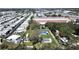 A mobile home park featuring multiple homes with white roofs and manicured lawns at 6673 146Th N Ave, Clearwater, FL 33764