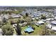 A mobile home park featuring multiple homes with white roofs and mature trees at 6673 146Th N Ave, Clearwater, FL 33764