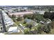 Aerial view of a spacious property with mature trees, a storage facility nearby, and easy access to the highway at 6673 146Th N Ave, Clearwater, FL 33764