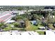 An aerial view showcases a property outlined in red, complete with mature trees, and surrounded by convenient highway access at 6673 146Th N Ave, Clearwater, FL 33764