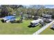 Aerial view of multiple homes with overgrown lawn on a sunny day at 6673 146Th N Ave, Clearwater, FL 33764