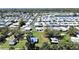 A mobile home park with tree-lined streets and a mix of well-maintained homes at 6673 146Th N Ave, Clearwater, FL 33764