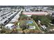 Aerial view of a spacious lot outlined in red, featuring mature trees and access to both community living and commercial convenience at 6673 146Th N Ave, Clearwater, FL 33764
