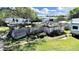 A heavily damaged home with debris and overgrown vegetation, requiring significant repair at 6673 146Th N Ave, Clearwater, FL 33764