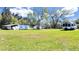 Exterior view of multiple homes with overgrown lawn on a sunny day at 6673 146Th N Ave, Clearwater, FL 33764